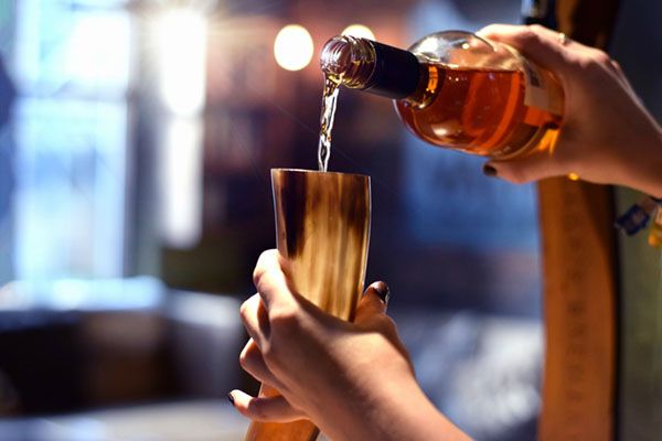 Mead being poured into a viking-style horn at the Valhalla pub in York