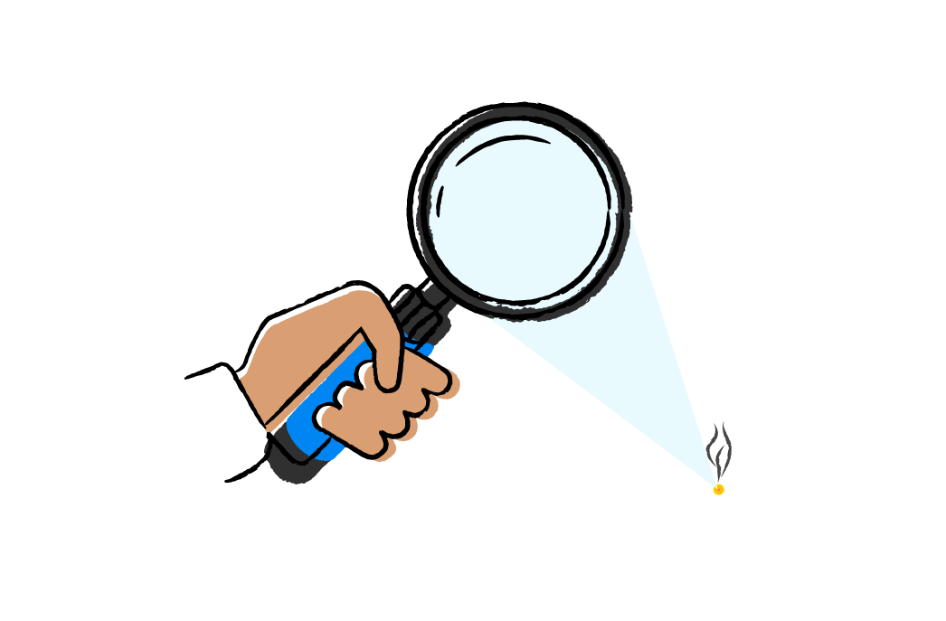 hand holding magnifying glass with tiny flame
