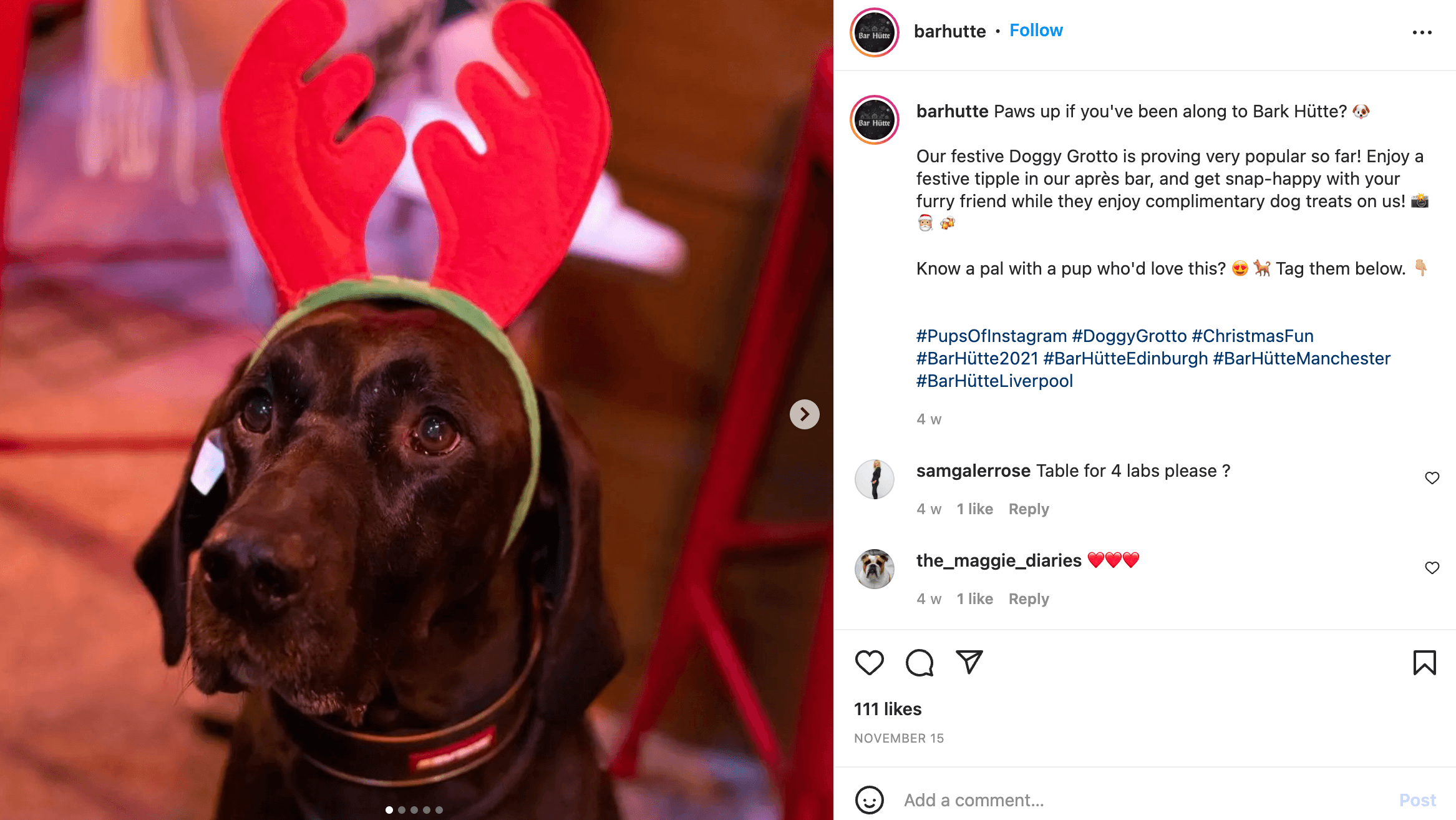 Instagram post of a black labrador wearing festive antlers