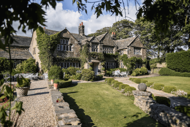 Exterior of Holdsworth House Hotel and garden in the sunshine