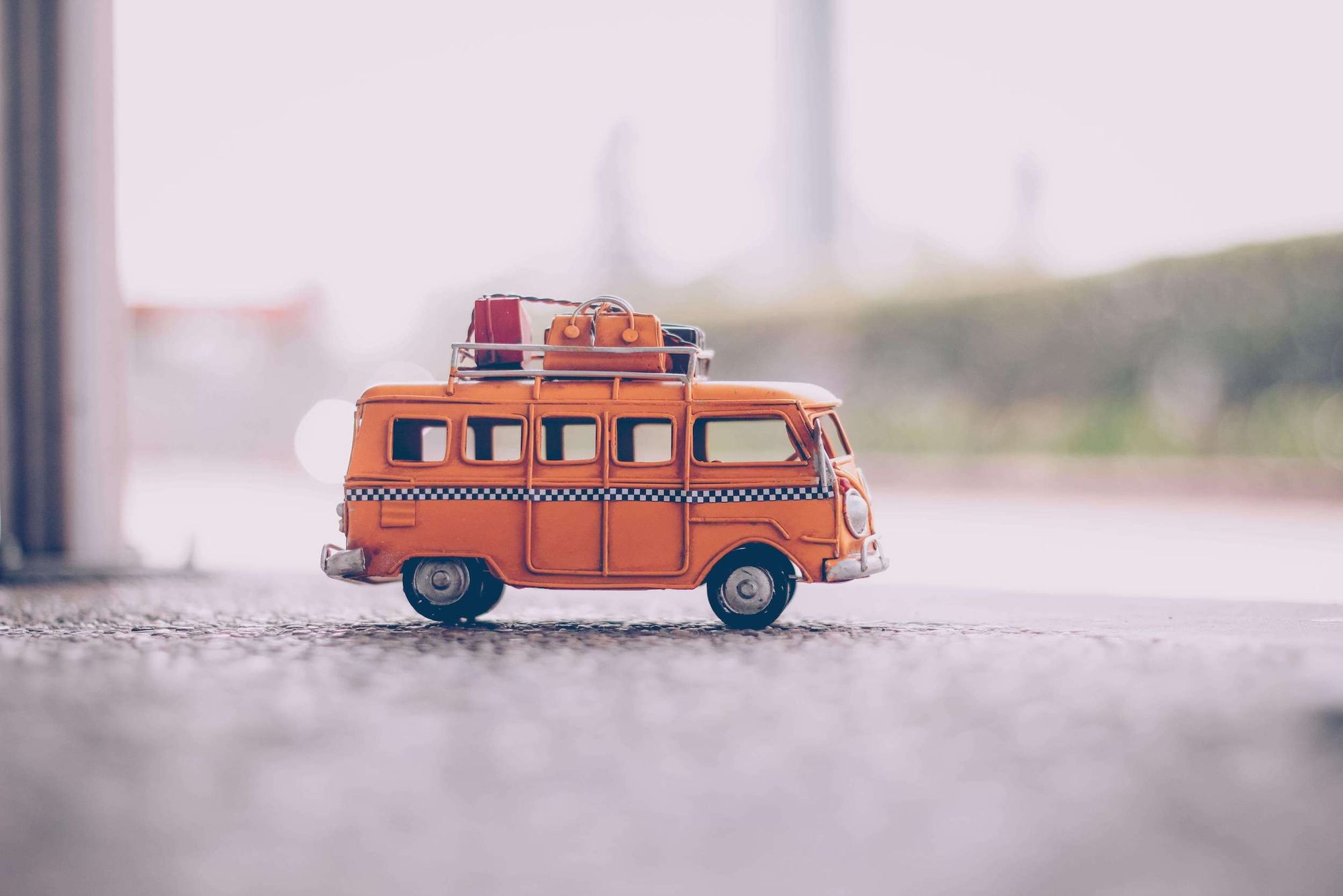 Camper van toy with roof rack and tiny luggage