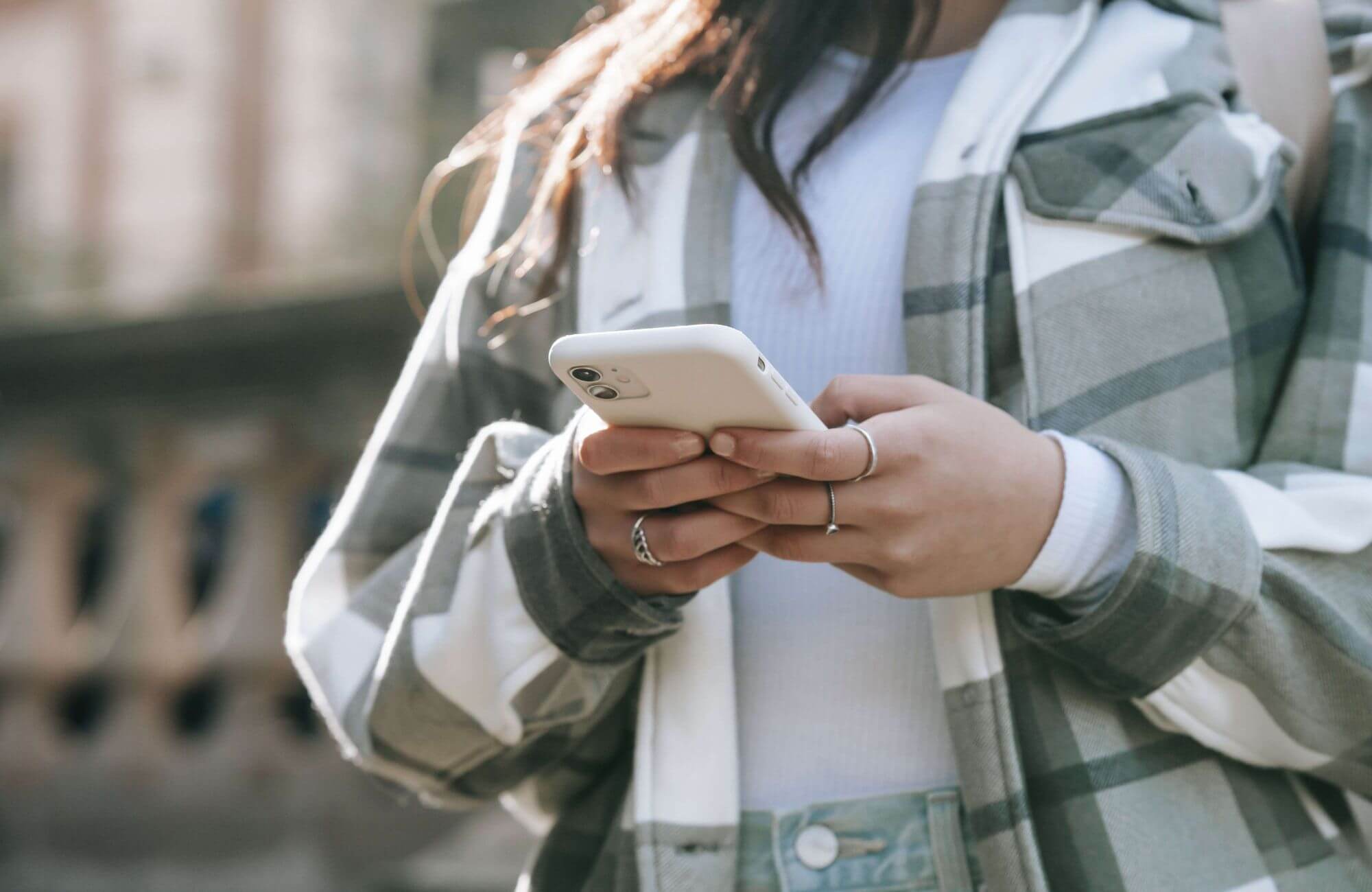 A woman looking at her mobile phone